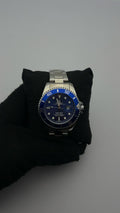 RX SUBMRN ACERO TRADICIONAL PLATEADO CARA AZUL BISEL AZUL C.A.A