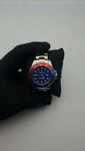 RX SEA ACERO/PLATEADO CARA/AZUL BISEL ROJO/AZUL