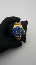 RX SUBMRN ACERO TRADICIONAL DORADO CARA AZUL BISEL AZUL