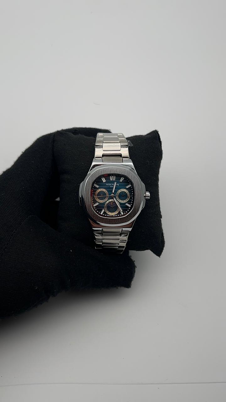 PTK ACERO/PLATEADO CARA/AZUL/3 CRONOS/PLATEADA BISEL/PLATEADO