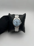 CRRN DAMA 9096 ACERO/PLATEADO/TRENZADO CARA/AZUL CLARA/CUBANA BISEL/PLATEADO/LISO